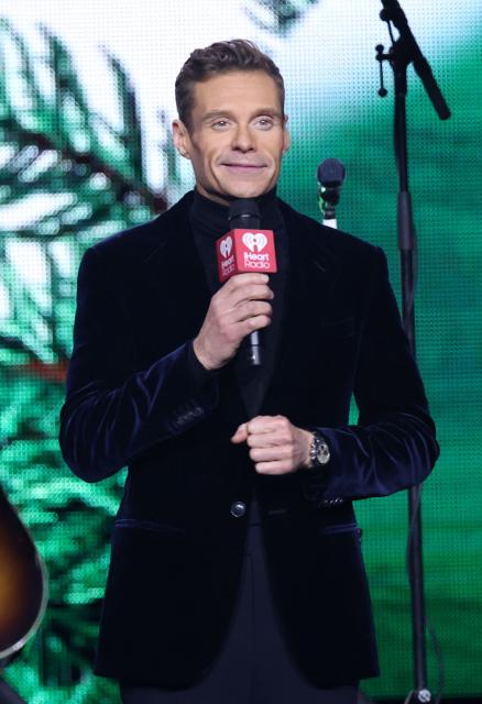 US radio personality and TV host Ryan Seacrest speaks during the KIIS FM's iHeartRadio Jingle Ball 2025 at the Inuit Dome in Inglewood, California on December 4, 2025. (Photo by Michael Tran / AFP)