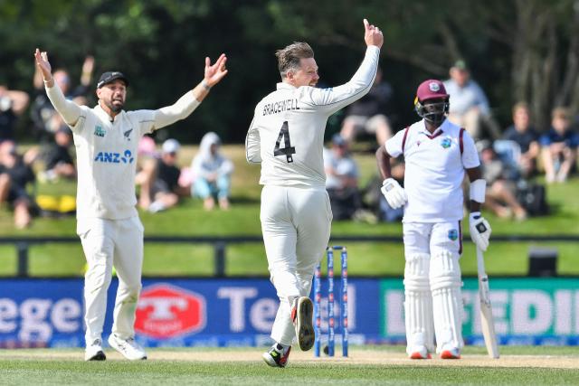 New Zealand's Michael Bracewell (C) unsuccessfully appeals for the wicket of West Indies' Kemar Roach during day five of the first Test cricket match between New Zealand and West Indies at Hagley Oval in Christchurch on December 6, 2025. (Photo by Sanka Vidanagama / AFP)