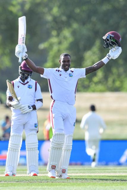 West Indies' Justin Greaves celebrates his double century during day five of the first Test cricket match between New Zealand and West Indies at Hagley Oval in Christchurch on December 6, 2025. (Photo by Sanka Vidanagama / AFP)