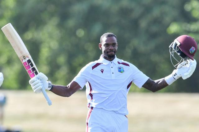 West Indies' Justin Greaves celebrates his double century during day five of the first Test cricket match between New Zealand and West Indies at Hagley Oval in Christchurch on December 6, 2025. (Photo by Sanka Vidanagama / AFP)