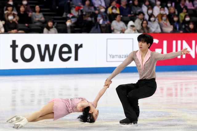 China's Chen Yuxuan and Dong Yinbo compete in the Junior Pairs Free Skating at the ISU Grand Prix of Figure Skating Final in Nagoya on December 6, 2025. (Photo by PAUL MILLER / AFP)