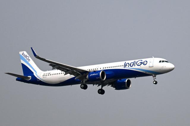 An IndiGo Airways aircraft prepares to land at the Mumbai airport on December 6, 2025. India's aviation ministry on December 5 rolled back a new policy of weekly rest for pilots after chaos caused by hundreds of flight cancellations by the country's biggest airline, IndiGo. (Photo by Punit PARANJPE / AFP)