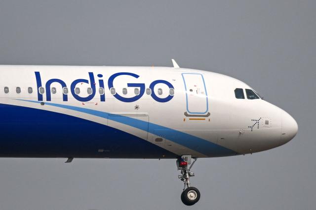 An IndiGo Airways aircraft prepares to land at the Mumbai airport on December 6, 2025. India's aviation ministry on December 5 rolled back a new policy of weekly rest for pilots after chaos caused by hundreds of flight cancellations by the country's biggest airline, IndiGo. (Photo by Punit PARANJPE / AFP)