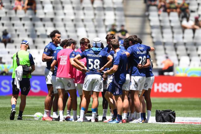 France players form a huddle during the pool B HSBC World Rugby Sevens Series men's rugby match between Spain and France at the DHL stadium in Cape Town on December 6, 2025. (Photo by Rodger Bosch / AFP)