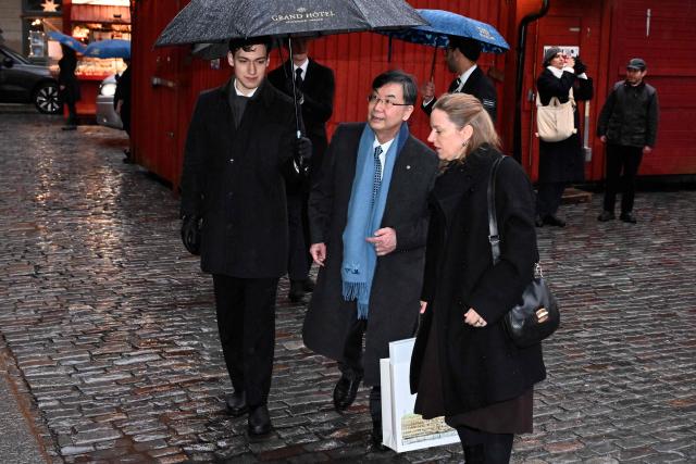 Japanese Nobel Prize winning immunologist Shimon Sakaguchi (C) arrives to sign the Nobel Chairs along with other Nobel laureates at the Nobel Museum in Stockholm on December 6, 2025. (Photo by Claudio BRESCIANI / TT NEWS AGENCY / AFP) / Sweden OUT