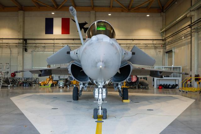 This photograph shows a French Air and Space Force Dassault Rafale C-5GN fighter jet displayed during a media presentation on the implementation of the National Service scheme, including an initial military training and support for young volunteers within the Air and Space Force (AAE), at the training centre of Air Base 115 in Orange, southeastern France, December 5, 2025. 600 young people will start their National Service by the end of 2026. The objective of the Air and Space Force is to have trained 2000 aviators by 2030 in the frame of this new National Service. (Photo by CLEMENT MAHOUDEAU / AFP)
