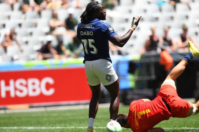 France's Ali Dabo celebrates after scoring a try during the pool B HSBC World Rugby Sevens Series men's rugby match between Spain and France at the DHL stadium in Cape Town on December 6, 2025. (Photo by Rodger Bosch / AFP)