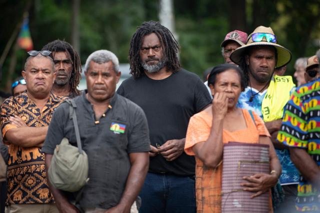 Kanak Independence activist Dimitri Quenegei (C) takes part in the congress of the Kanak and Socialist National Liberation Front (FLNKS), New Caledonia's main pro-independence movement, in Ponerihouen, in the French overseas collectivity of New Caledonia, on December 6, 2025. (Photo by Delphine MAYEUR / AFP)