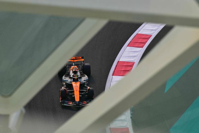 TOPSHOT - McLaren's Australian driver Oscar Piastri drives during the third practice session ahead of the Abu Dhabi Formula One Grand Prix at the Yas Marina Circuit in Abu Dhabi on December 6, 2025. (Photo by Andrej ISAKOVIC / AFP)