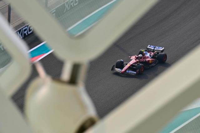 Ferrari's British driver Lewis Hamilton drives during the third practice session ahead of the Abu Dhabi Formula One Grand Prix at the Yas Marina Circuit in Abu Dhabi on December 6, 2025. (Photo by Andrej ISAKOVIC / AFP)