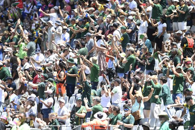 Supporters react during the pool A HSBC World Rugby Sevens Series men's rugby match between South Africa and Fiji at the DHL stadium in Cape Town on December 6, 2025. (Photo by Rodger Bosch / AFP)
