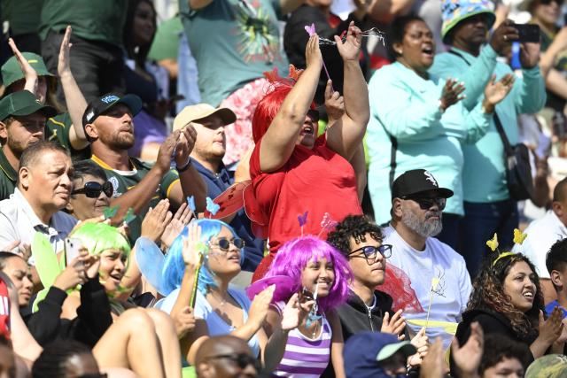 Supporters react during the pool A HSBC World Rugby Sevens Series men's rugby match between New Zealand and South Africa at the DHL stadium in Cape Town on December 6, 2025. (Photo by Rodger Bosch / AFP)