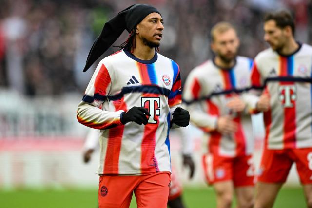 Bayern Munich's French midfielder #17 Michael Olise warms up prior to the German first division Bundesliga football match between VfB Stuttgart and Bayern Munich in Stuttgart on December 6, 2025. (Photo by THOMAS KIENZLE / AFP) / DFL REGULATIONS PROHIBIT ANY USE OF PHOTOGRAPHS AS IMAGE SEQUENCES AND/OR QUASI-VIDEO
