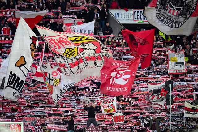Stuttgart fans cheer their team during the German first division Bundesliga football match between VfB Stuttgart and Bayern Munich in Stuttgart on December 6, 2025. (Photo by THOMAS KIENZLE / AFP) / DFL REGULATIONS PROHIBIT ANY USE OF PHOTOGRAPHS AS IMAGE SEQUENCES AND/OR QUASI-VIDEO