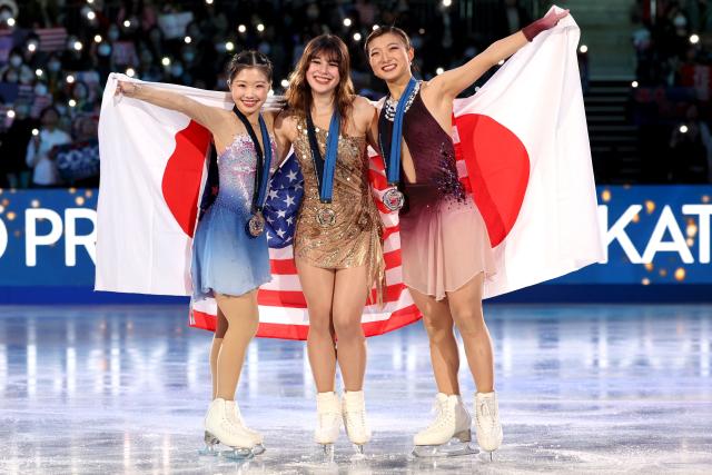 Gold medalist USA's Alysa Liu (C), silver medalist Japan's Kaori Sakamoto (L) and bronze medalist Japan's Ami Nakai pose after the award ceremony for the Senior Women Free Skating event at the ISU Grand Prix of Figure Skating final in Nagoya on December 6, 2025. (Photo by PAUL MILLER / AFP)