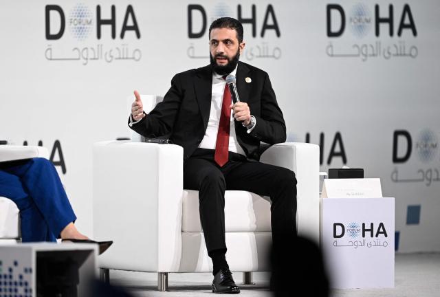 Syrian President Ahmed al-Sharaa speaks during the opening day of the Doha Forum, an annual diplomatic conference, in Doha on December 6, 2025. Sharaa warned on December 6 that Israel's demand for a demilitarised zone in southern Syria would endanger his country, as Israeli forces continue to operate in the area. (Photo by Mahmud HAMS / AFP)