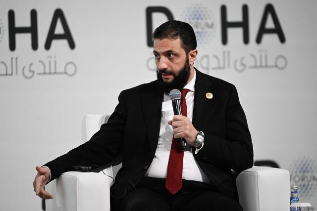 Syrian President Ahmed al-Sharaa speaks during the opening day of the Doha Forum, an annual diplomatic conference, in Doha on December 6, 2025. Sharaa warned on December 6 that Israel's demand for a demilitarised zone in southern Syria would endanger his country, as Israeli forces continue to operate in the area. (Photo by Mahmud HAMS / AFP)