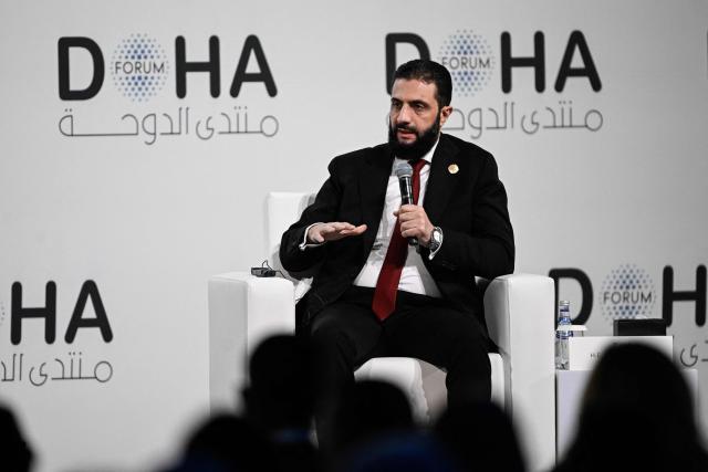 Syrian President Ahmed al-Sharaa speaks during the opening day of the Doha Forum, an annual diplomatic conference, in Doha on December 6, 2025. Sharaa warned on December 6 that Israel's demand for a demilitarised zone in southern Syria would endanger his country, as Israeli forces continue to operate in the area. (Photo by Mahmud HAMS / AFP)