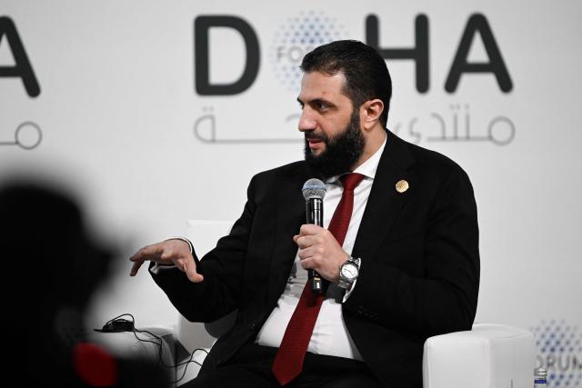 Syrian President Ahmed al-Sharaa speaks during the opening day of the Doha Forum, an annual diplomatic conference, in Doha on December 6, 2025. Sharaa warned on December 6 that Israel's demand for a demilitarised zone in southern Syria would endanger his country, as Israeli forces continue to operate in the area. (Photo by Mahmud HAMS / AFP)