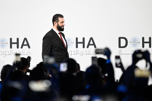 Syrian President Ahmed al-Sharaa attends the opening day of the Doha Forum, an annual diplomatic conference, in Doha on December 6, 2025. Sharaa warned on December 6 that Israel's demand for a demilitarised zone in southern Syria would endanger his country, as Israeli forces continue to operate in the area. (Photo by Mahmud HAMS / AFP)