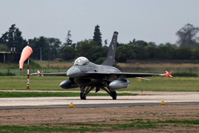 An Argentina's Air Force new F-16 Fighting Falcon plane lands during an official ceremony at the “Area de Material Rio IV" in Rio Cuarto, Cordoba province, Argentina on December 6, 2025. (Photo by Nicolas AGUILERA / AFP)