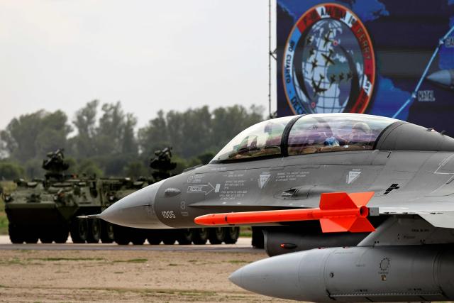 An Argentina's Air Force new F-16 Fighting Falcon plane lands during an official ceremony at the “Area de Material Rio IV" in Rio Cuarto, Cordoba province, Argentina on December 6, 2025. (Photo by Nicolas AGUILERA / AFP)