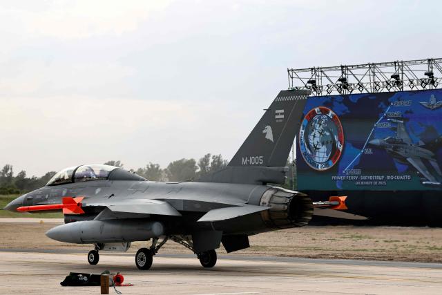 An Argentina's Air Force new F-16 Fighting Falcon plane lands during an official ceremony at the “Area de Material Rio IV" in Rio Cuarto, Cordoba province, Argentina on December 6, 2025. (Photo by Nicolas AGUILERA / AFP)