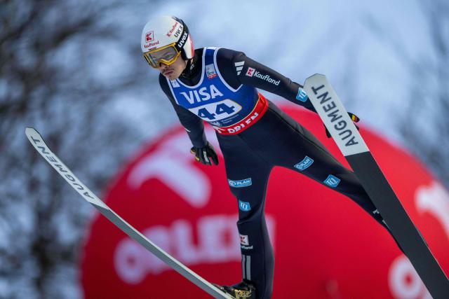 Germany's Philipp Raimund soars through the air during the Men's Large Hill HS134 competition of the FIS Ski Jumping World Cup in Wisla, Poland on December 06, 2025. (Photo by Wojtek RADWANSKI / AFP)