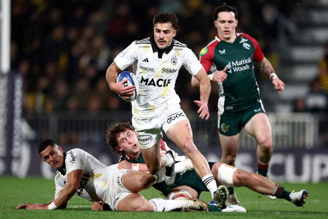 La Rochelle' Georgian wing Davit Niniashvili (c) runs with the ball during the European Rugby Champions Cup rugby union match between Stade Rochelais (La Rochelle) and Leicester Tigers at the Marcel-Deflandre Stadium in La Rochelle, western France on December 6, 2025. (Photo by ROMAIN PERROCHEAU / AFP)