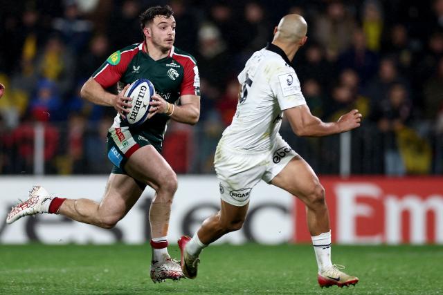 Leicester's English wing Adam Radwan (L) runs with the ball during the European Rugby Champions Cup rugby union match between Stade Rochelais (La Rochelle) and Leicester Tigers at the Marcel-Deflandre Stadium in La Rochelle, western France on December 6, 2025. (Photo by ROMAIN PERROCHEAU / AFP)