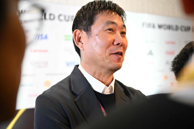 Japan's head coach Hajime Moriyasu speaks with members of the press after the FIFA World Cup 2026 official match schedule announcement in Washington, DC, on December 6, 2025. (Photo by Roberto SCHMIDT / AFP)
