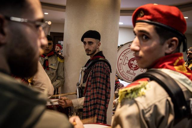 Members of a scouts marching band prepare to perform during a Christmas tree lighting ceremony in Nativity Square in Bethlehem, in the Israeli-occupied West Bank, on December 6, 2025. (Photo by JOHN WESSELS / AFP)