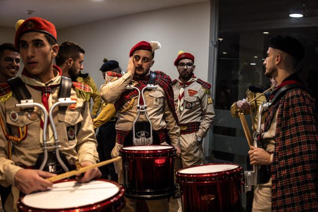 Members of a scouts marching band prepare to perform during a Christmas tree lighting ceremony in Nativity Square in Bethlehem, in the Israeli-occupied West Bank, on December 6, 2025. (Photo by JOHN WESSELS / AFP)