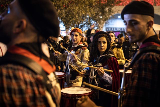 Members of the scouts marching band perform in Nativity Square during a Christmas tree lighting ceremony in Bethlehem, in the Israeli-occupied West Bank, on December 6, 2025. (Photo by JOHN WESSELS / AFP)