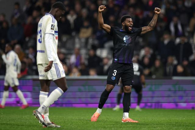 Toulouse's US defender #03 Mark Mckenzie (R) celebrates at the end of the French L1 football match between Toulouse FC and RC Strasbourg Alsace at the TFC Stadium in Toulouse, southwestern France, on December 6, 2025. (Photo by Valentine CHAPUIS / AFP)