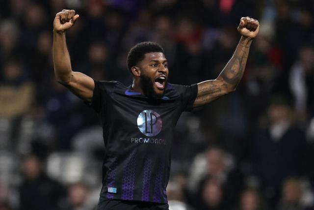 Toulouse's US defender #03 Mark Mckenzie (R) celebrates at the end of the French L1 football match between Toulouse FC and RC Strasbourg Alsace at the TFC Stadium in Toulouse, southwestern France, on December 6, 2025. (Photo by Valentine CHAPUIS / AFP)