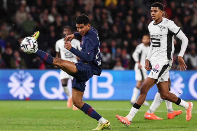 Paris Saint-Germain's French midfielder #24 Senny Mayulu kicks (L) the ball during the French L1 football match between Paris Saint-Germain (PSG) and Stade Rennais FC at the Parc des Princes stadium in Paris on December 6, 2025. (Photo by FRANCK FIFE / AFP)