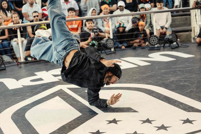 US Break Dancer Gravity performs during quarter finals of the Undisputed Cape Town length of Break Dance championship in Cape Town on December 6, 2025. (Photo by GIANLUIGI GUERCIA / AFP)