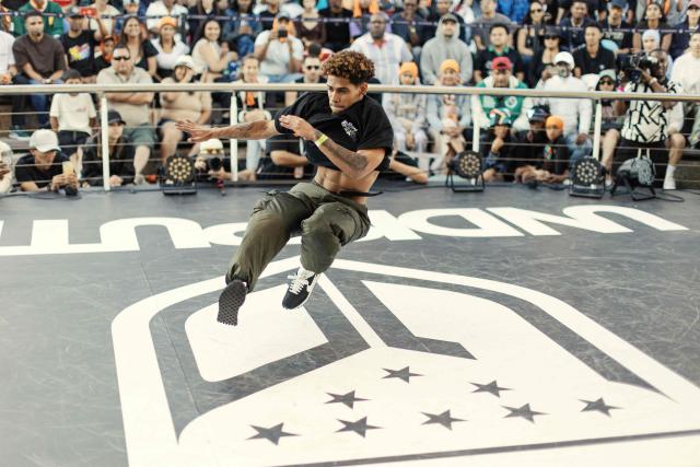 South African Break Dancer Boy Toufeeq performs during quarter finals of the Undisputed Cape Town length of Break Dance championship in Cape Town on December 6, 2025. (Photo by GIANLUIGI GUERCIA / AFP)