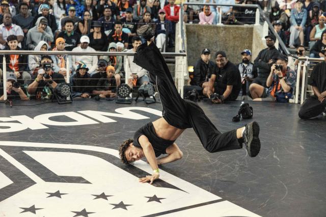 South African Break Dancer Boy Toufeeq performs during quarter finals of the Undisputed Cape Town length of Break Dance championship in Cape Town on December 6, 2025. (Photo by GIANLUIGI GUERCIA / AFP)