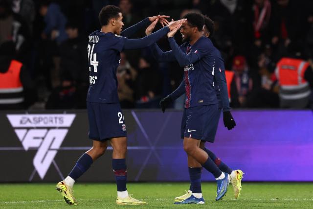 Paris Saint-Germain's French forward #49 Ibrahim Mbaye (R) celebrates scoring his team's fourth goal during the French L1 football match between Paris Saint-Germain (PSG) and Stade Rennais FC at the Parc des Princes stadium in Paris on December 6, 2025. (Photo by FRANCK FIFE / AFP)