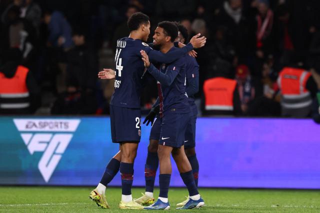 Paris Saint-Germain's French forward #49 Ibrahim Mbaye (R) celebrates scoring his team's fourth goal during the French L1 football match between Paris Saint-Germain (PSG) and Stade Rennais FC at the Parc des Princes stadium in Paris on December 6, 2025. (Photo by FRANCK FIFE / AFP)