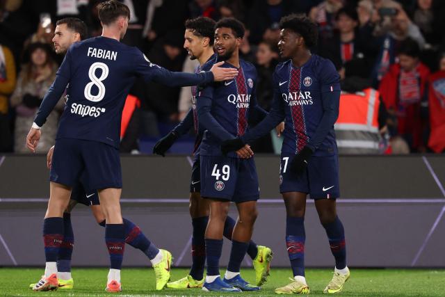 Paris Saint-Germain's French forward #49 Ibrahim Mbaye (C) celebrates scoring his team's fourth goal during the French L1 football match between Paris Saint-Germain (PSG) and Stade Rennais FC at the Parc des Princes stadium in Paris on December 6, 2025. (Photo by FRANCK FIFE / AFP)