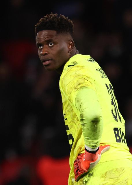 Rennes' French goalkeeper #30 Brice Samba reacts during the French L1 football match between Paris Saint-Germain (PSG) and Stade Rennais FC at the Parc des Princes stadium in Paris on December 6, 2025. (Photo by FRANCK FIFE / AFP)