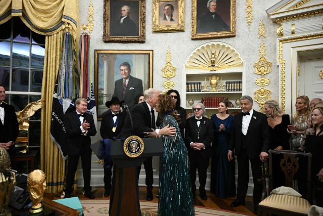Kennedy Centre Honours recipient singer Gloria Gaynor receives a medal from US President Donald Trump during the Kennedy Centre Honours medal presentation ahead of tomorrow's ceremony, in the Oval Office of the White House in Washington, DC, December 6, 2025. (Photo by Brendan SMIALOWSKI / AFP)