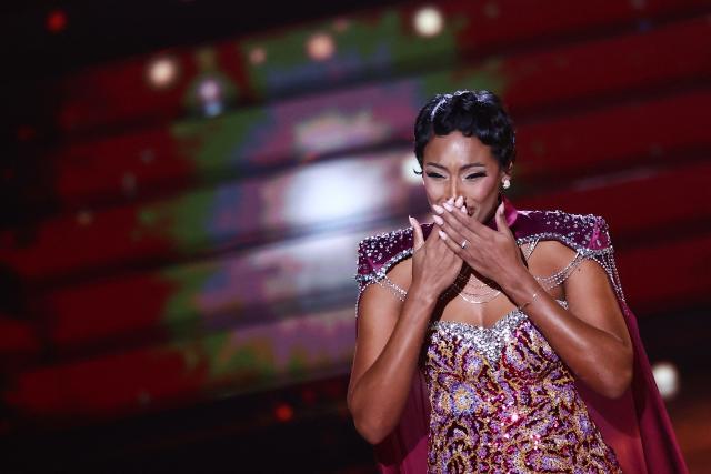 Miss France 2025 Angelique Angarni-Filopon reacts on stage during the Miss France 2026 beauty pageant at the Zenith, in Amiens, northern France, on December 6, 2025. (Photo by Sameer AL-DOUMY / AFP)