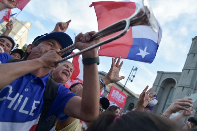 Supporters of Chilean presidential candidate Jose Antonio Kast of the Republican Party attend his closing campaign rally in Concepcion, Chile, on December 6, 2025. Chile will choose its next president in a runoff on December 14, with far-right candidate Jose Antonio Kast as the clear favorite against leftist Jeannette Jara, after a campaign marked by fears over crime and irregular migrants. (Photo by GUILLERMO SALGADO / AFP)