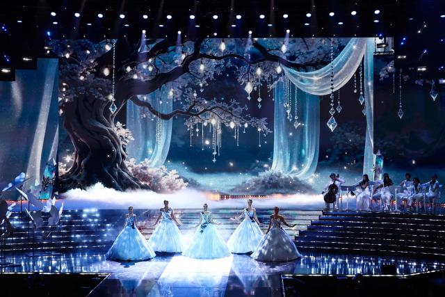The five finalists (from L) Miss Normandie Victoire Dupuis, Miss Guadeloupe Naomi Torrent, Miss Roussillon Deborah Adelin-Chabal, Miss Tahiti Hinaupoko Deveze and Miss Nouvelle-Caledonie Juliette Collet perform on stage during the Miss France 2026 beauty pageant at the Zenith, in Amiens, northern France, on December 6, 2025. (Photo by Sameer AL-DOUMY / AFP)
