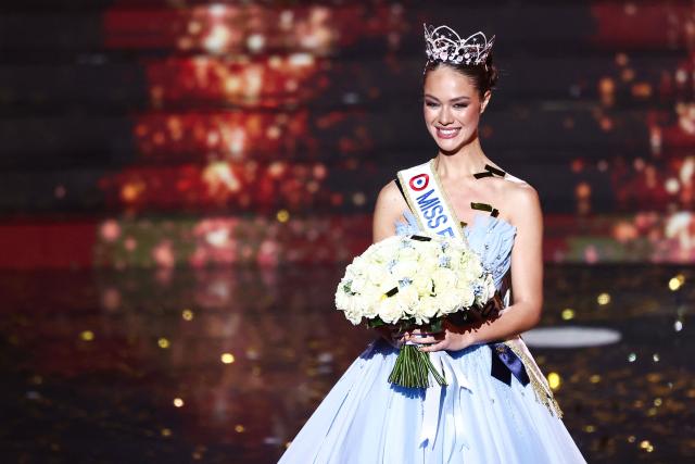 Newly elected Miss France 2026 Miss Tahiti Hinaupoko Deveze reacts after winning the Miss France 2026 beauty pageant at the Zenith, in Amiens, northern France, on December 6, 2025. (Photo by Sameer AL-DOUMY / AFP)