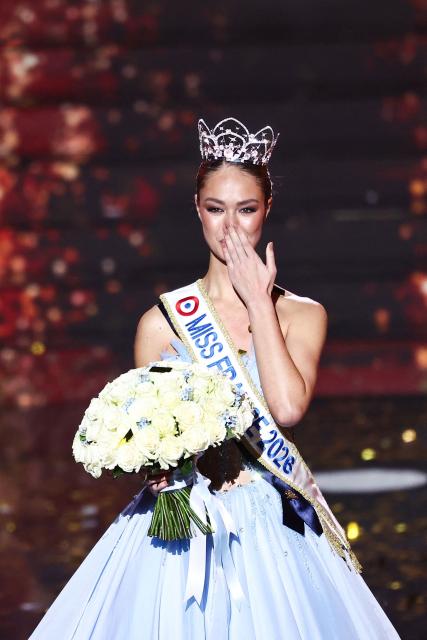 Newly elected Miss France 2026 Miss Tahiti Hinaupoko Deveze blows a kiss as she reacts after winning the Miss France 2026 beauty pageant at the Zenith, in Amiens, northern France, on December 6, 2025. (Photo by Sameer AL-DOUMY / AFP)